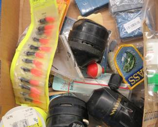Lot 211. Fishing jigs, hooks, reels, and more