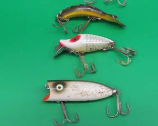 Lot 121. Hopin' for Heddon: Midgit River Runt, Baby Lucky 13, Baby Torpedo, Tadpoly Spook, and a River Runt Spook Floater.