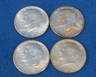 Lot 377. Four 1964 Kennedy half dollars. They are 90% silver and 10% copper.