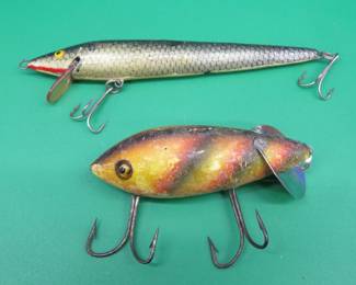 Lot 124. Vintage wooden Heddon Crab Wiggler with glass eyes and an unidentified stick bait in a Rebel box marked 3203 blue