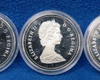 Lot 319. Three Canadian proof silver dollars: 1979 HMS Griffon, 1988 Iron Works, and 1989 Mackenzie River
