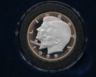 Lot 410. $10.00 Kennedy Memorial .999 silver proof coin minted in Liberia. Weight 14.6 grams