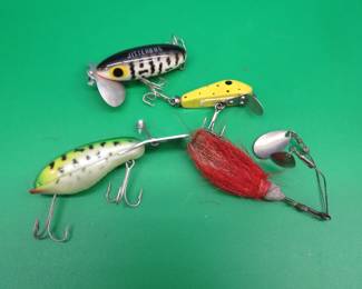 Lot 58. Four vintage baits: Paul Bunyan 1 3/4" Dynamite, Fred Arbogast 2 1/8'' Jitterbug, Tandem horsehair spinner, Arbogast Mud Bug