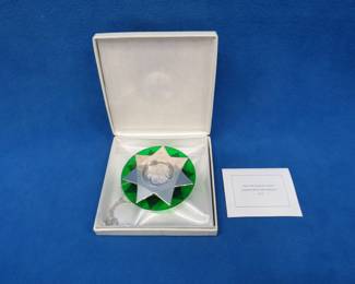 Lot 179. 1974 Franklin Mint "Hark{!} The Herald Angels Sing" sterling silver Christmas ornament. Medallion and star accents are sterling silver, 46.5 grams.