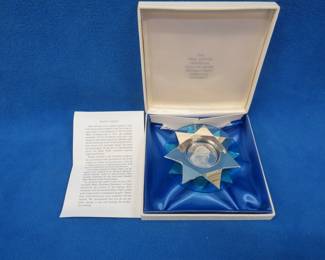 Lot 177. 1971 Franklin Mint "Silent Night" sterling silver Christmas ornament. Total weight of medallion and sterling silver decorative stars is 46.5 grams.