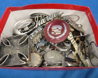 Lot 322. Large group of auto emblems and more