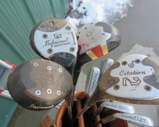 Lot 340. Voit golf bag with 4 woods and seven irons along with a pair of crutches in case you break your leg