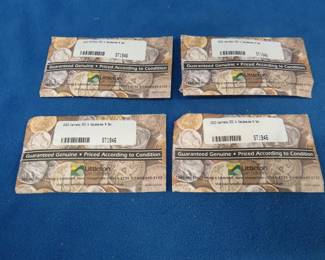 Lot 436. Four 2003 Littleton uncirculated Kennedy & Sacagawea sets. Each set contains 2 Kennedy halves and two Sacagawea dollar coins