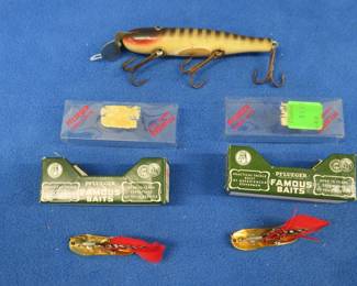 Lot 150. Vintage CCBC Wooden Pikie with glass eyes, two Pflueger gold Chum Spoons in original boxes