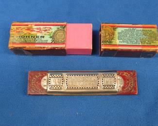 Lot 119. Hohner Marine Band tremolo harmonica in the key of G. Two-piece box is in fair condition. Sounds great.