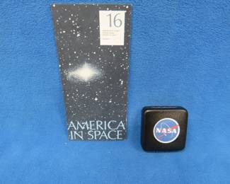 Lot 80. America in Space commemorative sterling silver medallion. 25.91 grams. Includes original brochure.