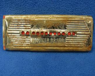 Lot 113. Pioneer Brand Duplex double-sided tremolo harmonica. Poor sound with surface rust.