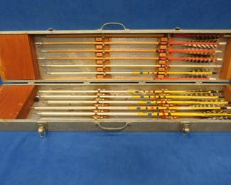 Lot 30. 18 cedar shaft arrows in a vintage 37" x 8" x 4" aluminum covered archery box and more.