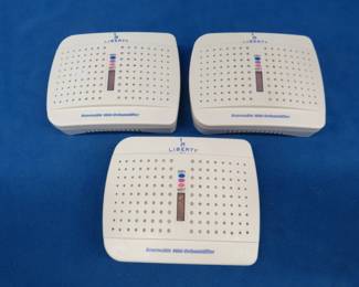 Lot 243. Three like new rechargeable mini-dehumidifiers. Great for gun safes.