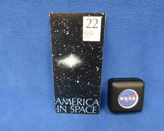 Lot 82. America in Space commemorative sterling silver medallion. 26.65 grams. Includes original brochure.