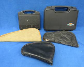 Lot 240. Three soft-sided and two hard-sided handgun cases. Phoenix case is unlocked with no key.