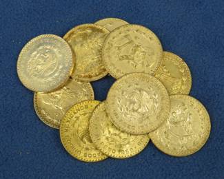 Lot 396. Ten Mexican one peso 10% silver coins. Dates range from 1957-1966.