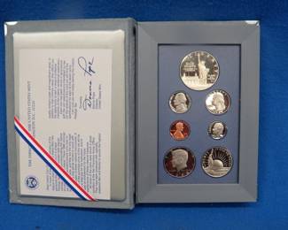 Lot 32. U.S. 1986 Liberty Prestige Set including a 90% Silver Dollar