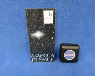 Lot 84. America in Space commemorative sterling silver medallion. 26.72 grams. Includes original brochure.