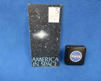 Lot 85. America in Space commemorative sterling silver medallion. 26.00 grams. Includes original brochure.