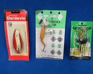 Lot 152. Three NIP baits: Eppinger Daredevle, Falls Bait Spin-Pop, Diamond Jim