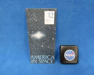Lot 83. America in Space commemorative sterling silver medallion. 27.07 grams. Includes original brochure.