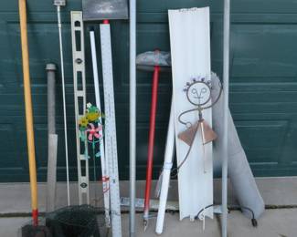 Lot 354. Long-handled tools including an ice chipper, level, weed puller, garden art, and more