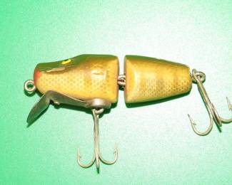 Lot 384. Vintage Paw Paw {#}9100 2 5/8" jointed wooden River Runt style with tack eyes