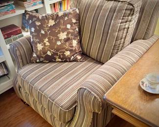 Second of two deep armchairs