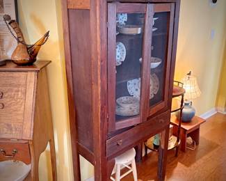 Antique pie safe with bottom drawer. Holding Churchill "Finlandia" china set.