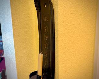 Second of two black tin tole-painted candle sconces