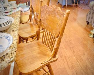 Three oak swivel bar stools (3rd stool is in garage)