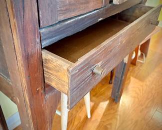 Antique pie safe with bottom drawer. Holding Churchill "Finlandia" china set.