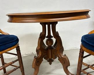 19th century Victorian style round table with matching cane chairs,