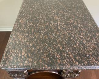 Beveled edge granite top. This is in great condition.