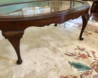 Cherry glass top coffee table with recessed bubble glass.