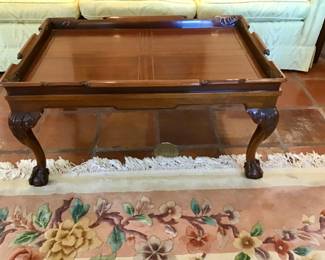 English Chippendale Mahogany coffee table with carved top to mimic a rolled handle. 