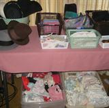 Under this table are 2 more bins of vinrage unused bras