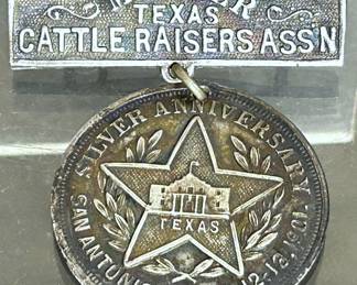 Rare antique Texas Cattle Raisers Association Member badge pin in Coin Silver. Texas Cattle Raisers Association was formed in the 1870s. This pin was to mark the 25th Silver Anniversary of the association in 1901. Provenance. This was handed down to Diana Wheelock of Corsicana through her mother Clara. Clara's maternal grandfather was Charles Quinton Hassard, born in Ireland in 1846 and who settled in Texas in 1882. He and his brother, John, would establish the Hassard Brothers Cattle company and operated in Coleman, San Angelo, and Tom Green County, Texas in the 1890s. He was very active in the Texas Cattle Raisers Association He married a young widow, Mary E. Mather in 1882 and adopted her her daughter, ILA Ruth. ILA Ruth married Frank Sanson of Fort Worth whose father, Marion Sanson owned the land that Sanson Park of Fort Worth is located He died in Fort Worth, TX in 1936.