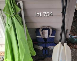 Pair of paddles, life vest and Caribbean Joe beach umbrella