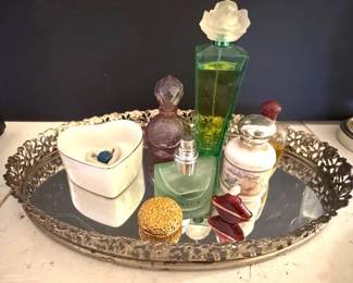 Vintage perfumes on a mirrored vanity tray