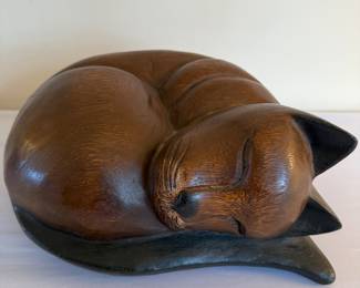 Carved wood curled cat