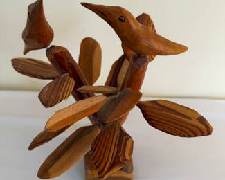 Folk art carved wood birds in tree