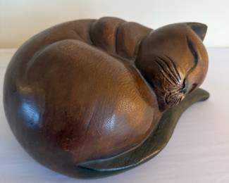 Carved wood curled cat