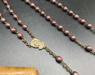 Rosary made with wooden beads in leather case