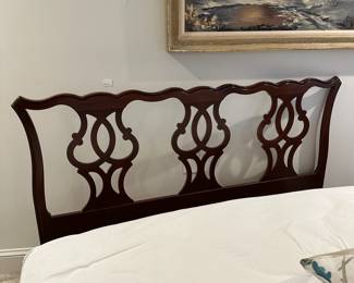 F104 - $250. Drexel Heritage Queen Bedframe in Cherry. Measures 62" wide x 80" long x 43" tall. 