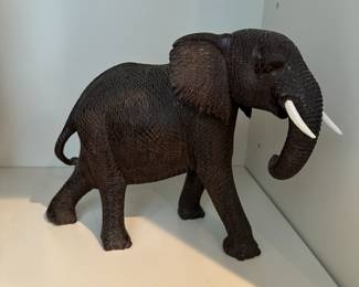 F61 - Decorative Carved Wooden Elephant. Signed Musyoki. Measures 9" Wide x 3" Deep x 7" Tall