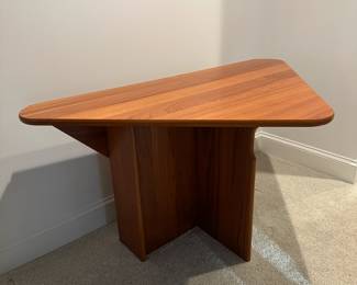 F94 - $950. Danish Teak Triangular Drop Leaf Table. Sides drop down making it narrow enough for a hallway or sofa table but opens large enough for 4 people. Measures 10" wide when folded down x 52" long. Each leaf comes up 22". So a 52" x 54" almost square!