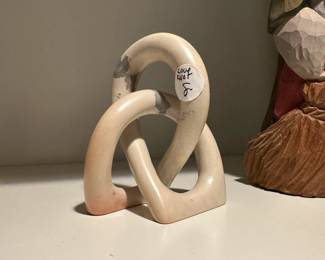 F109 - $8. Carved Love Knot. 