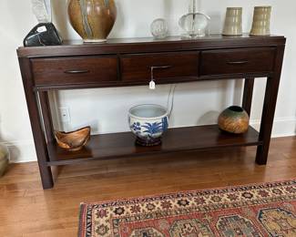 F32 - $125. Side Table/ Sofa Table. Measures 60" long x 14" deep x 34.75" tall.  Was used to store candles to one drawer is scented. 